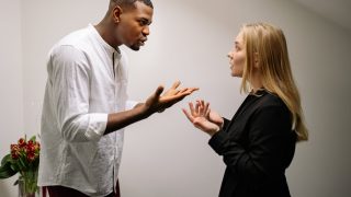 man having an argument with a woman